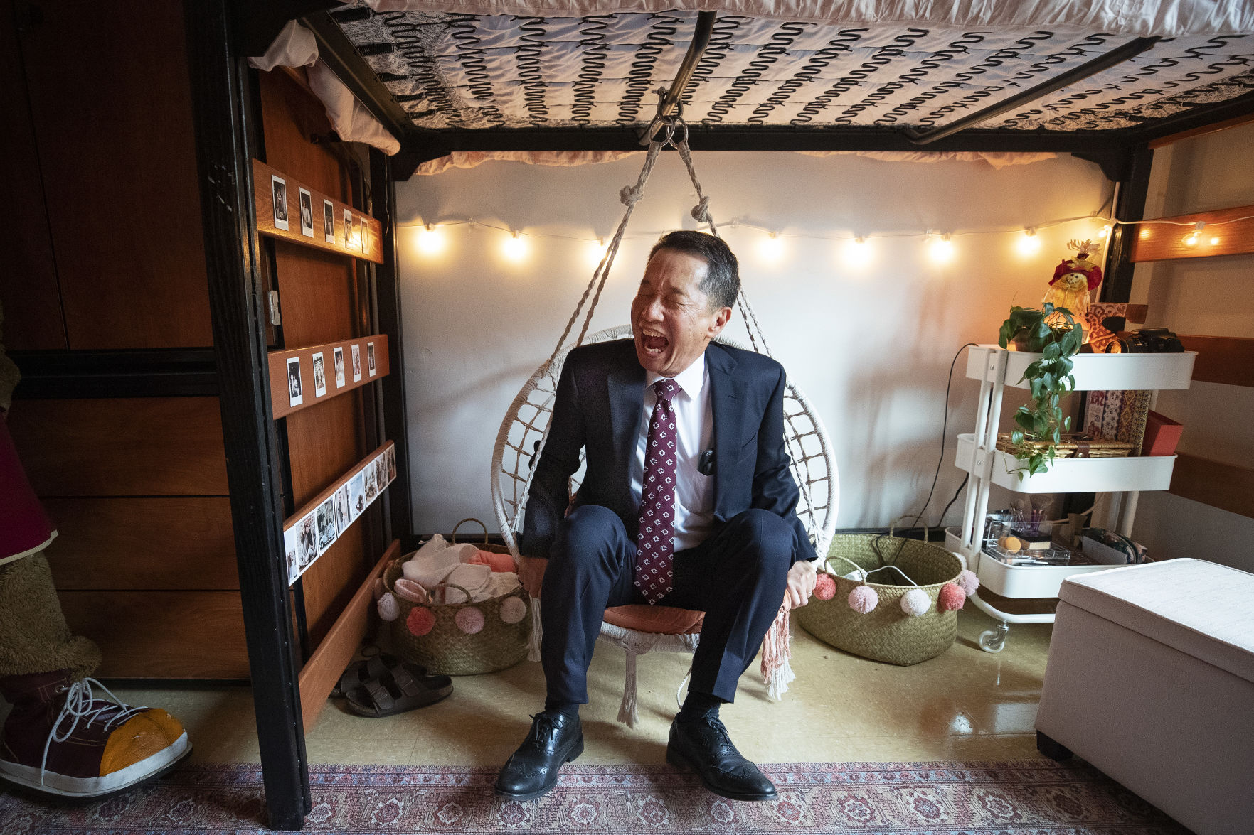 INSIDE LEDE Hsu in dorm chair swing.jpg